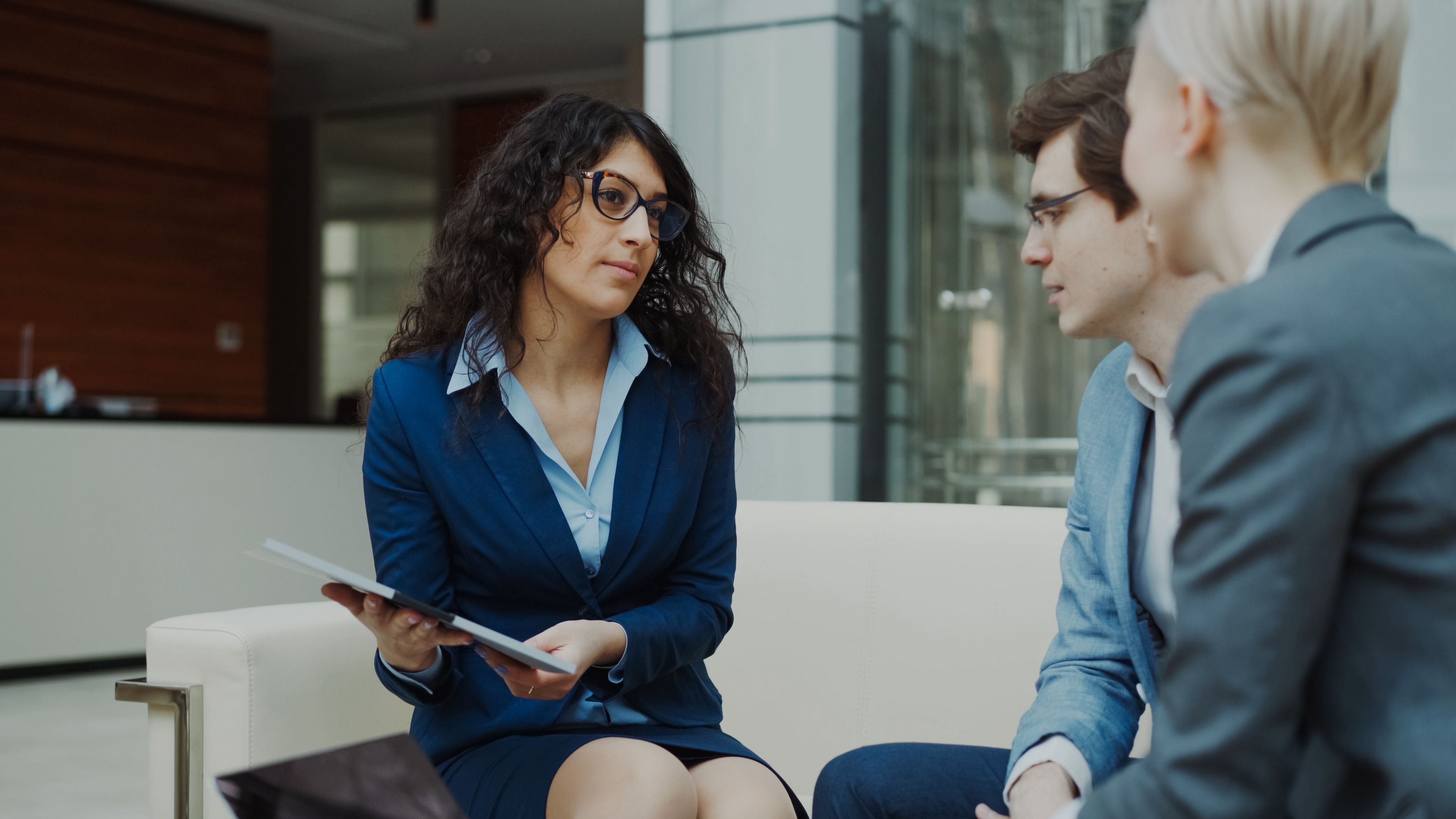 Professional student consultant advising a student in a modern office environment